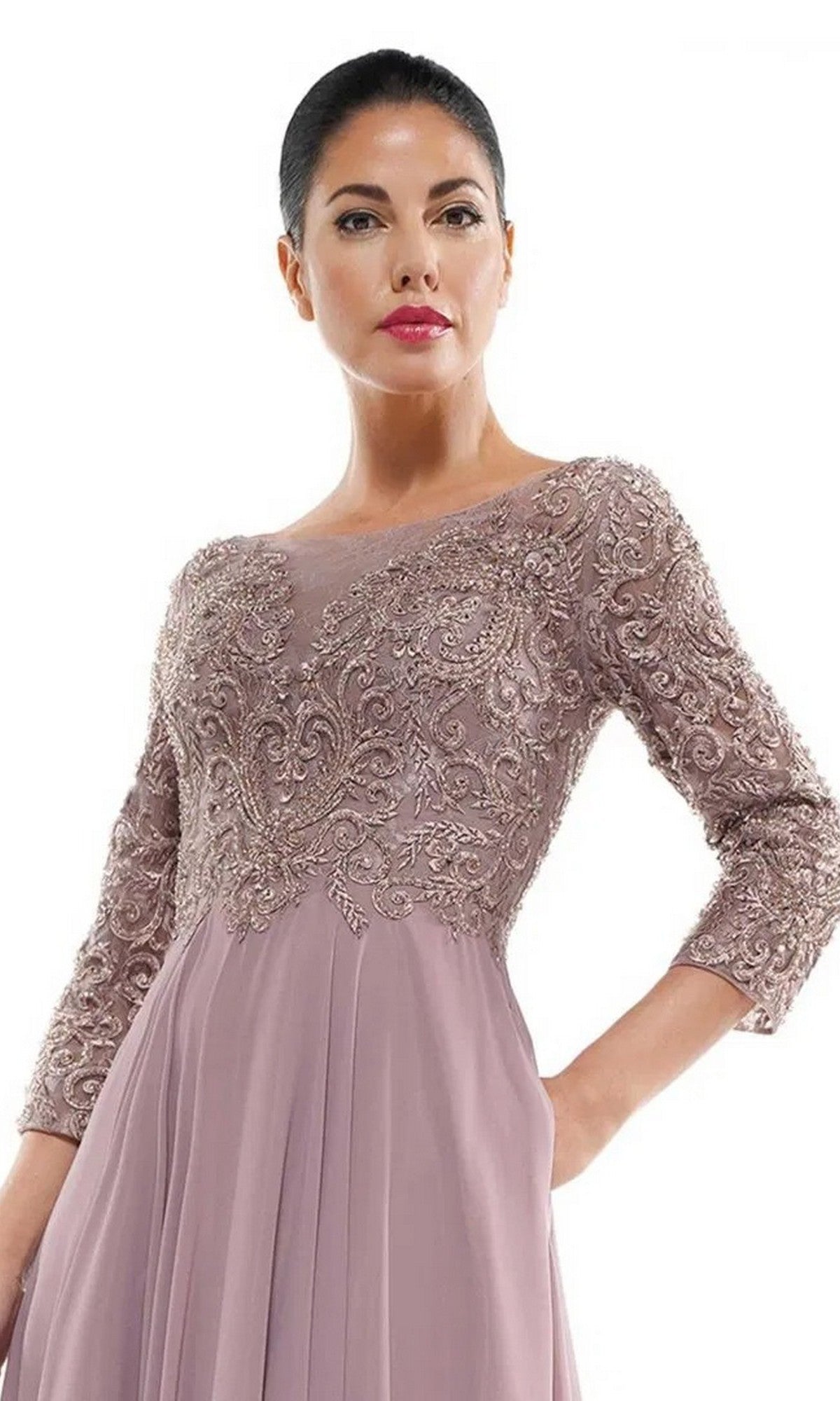 A woman models the Marsoni MV1052 long formal dress, featuring a beaded bodice, three-quarter sleeves, and a mauve chiffon A-line skirt, posing against a plain white background.